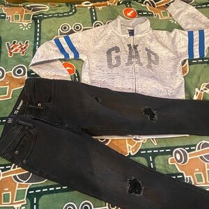 GAP Heather Gray Jacket with Blue Accents and Black Ripped GAP Jeans.